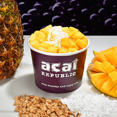 The Madly Mango - Base: Acai, Pineapple, Mango, Strawberry, Guarana (No Caffeine)
Topping: Granola, Mango, Pineapple and Coconut Shreds.